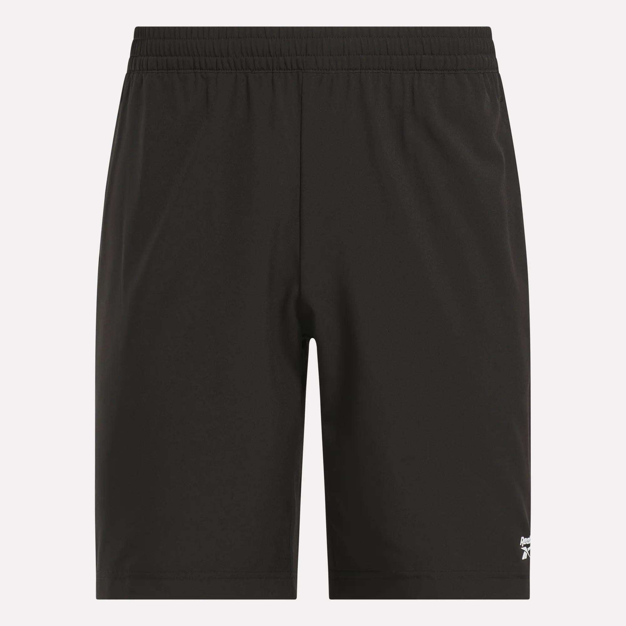A pair of Reebok Men's Range Shorts 9" in plain black, featuring an elastic waistband and a small white Reebok logo near the bottom left hem.