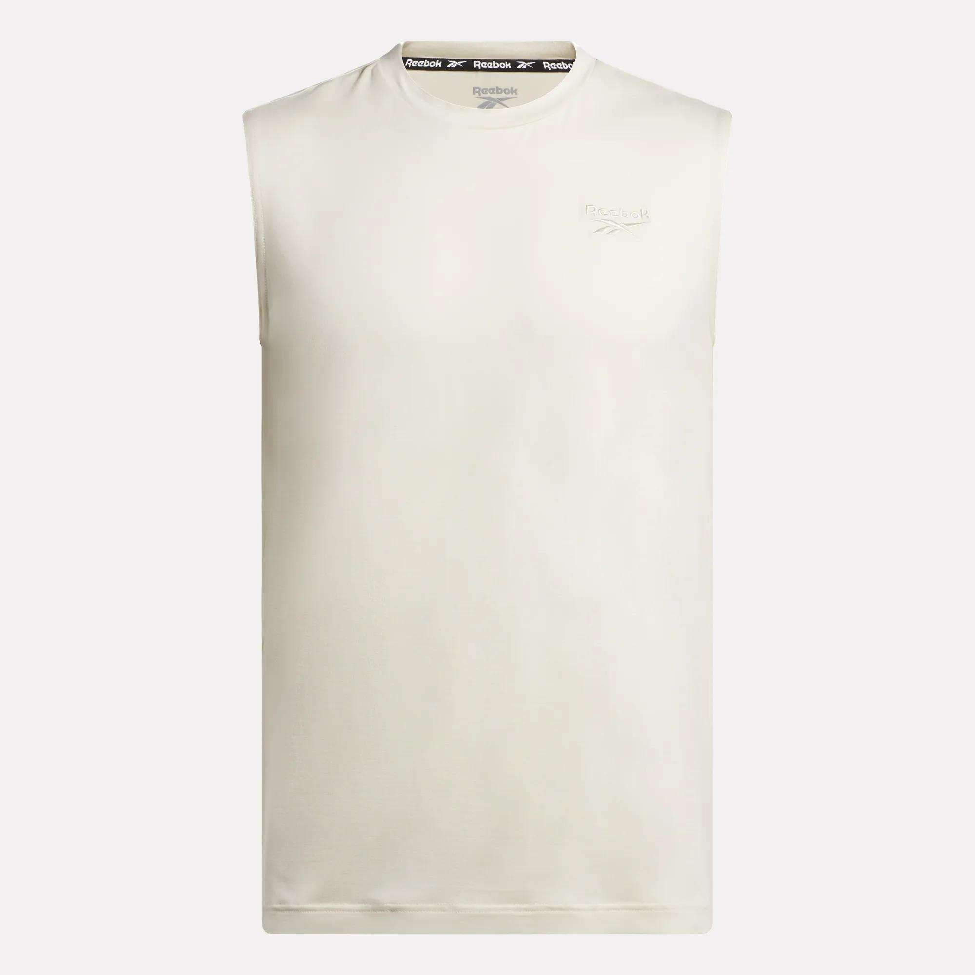 The Men's Elite Sleeveless Top by Reebok features a subtle logo on the left chest, crafted from cotton flex knit, and is displayed against a plain white background.