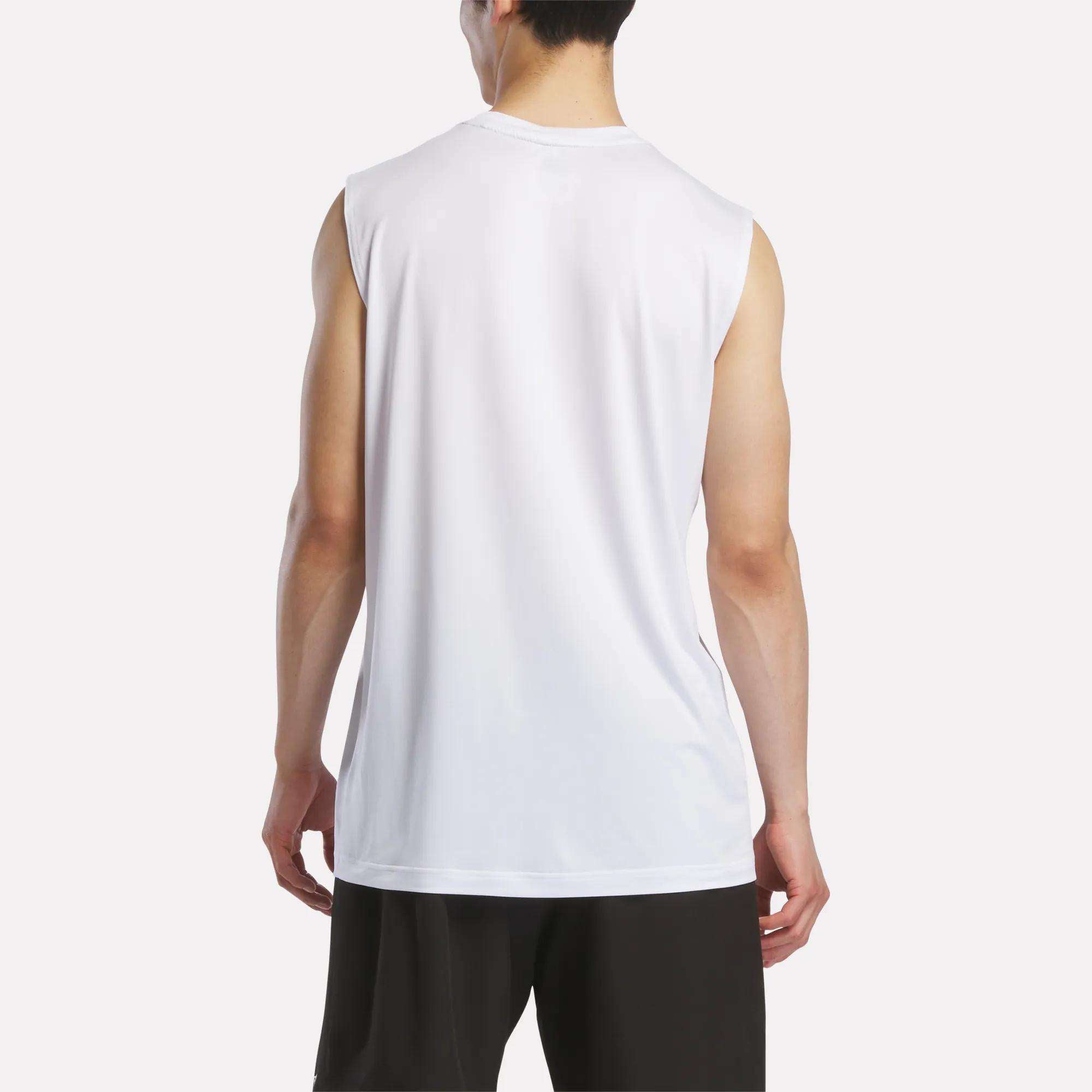 A person is seen from behind wearing a Reebok Men's Elite Sleeveless Top in white and black shorts, standing against a plain light background.