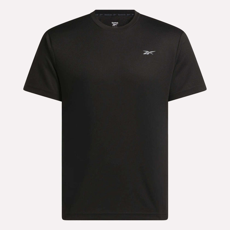 The Men's Director Short Sleeve Top by Reebok is a plain black, stretchy workout t-shirt with short sleeves and a small white Reebok logo on the left chest, shown against a white background.