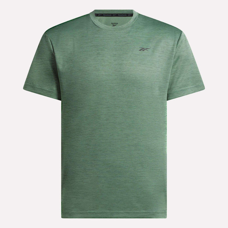 The Reebok Men's Director Short Sleeve Top is a plain, heathered green training tee with short sleeves, a crew neck, and a small Reebok logo on the left chest.