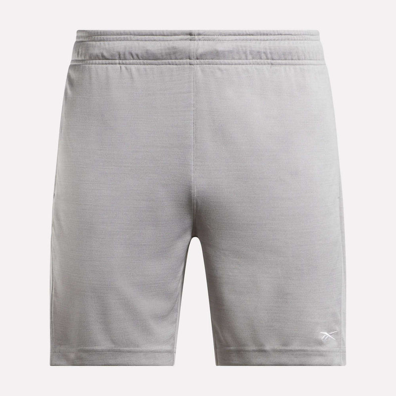 The Reebok Men's Inclination Shorts feature an elastic waistband and a white logo on the lower left leg, shown from the back in light gray—a versatile choice for men's workouts.