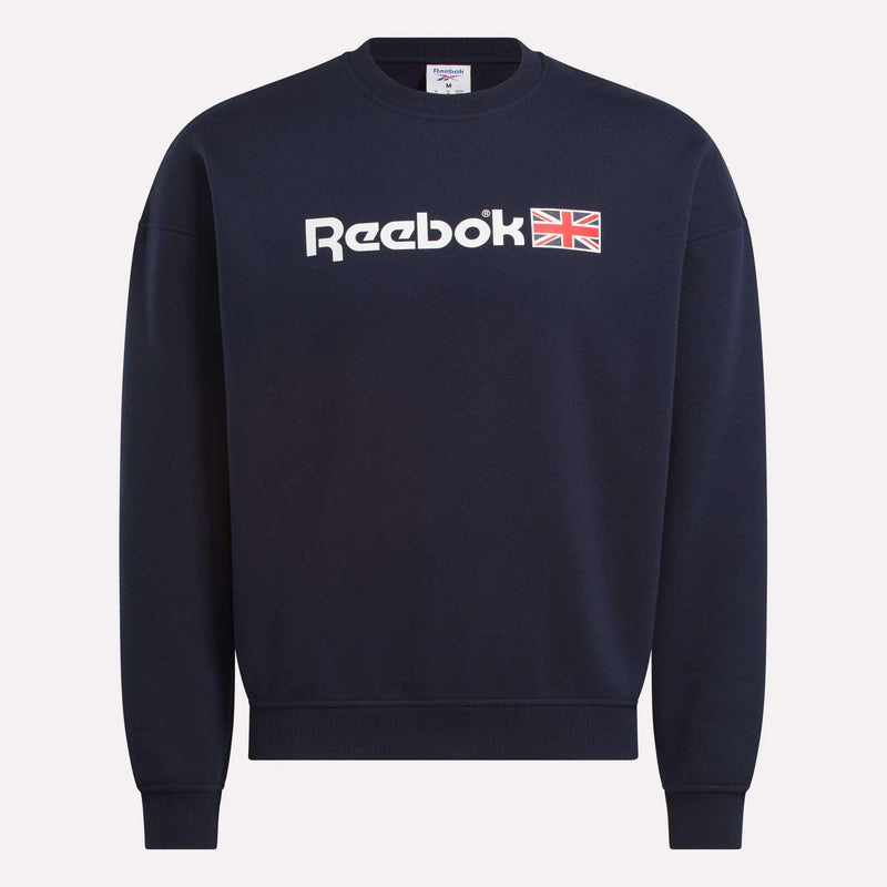 The Reebok Relaxed Fit Crew Neck Sweatshirt in navy features a white Reebok logo and small Union Jack on the front, shown against a light background—ideal for fans of classic Reebok heritage style.