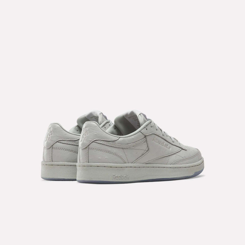 A pair of Reebok x BBC Club C 85 Shoes in light gray are displayed on a plain white background, shown from the back and side angles.