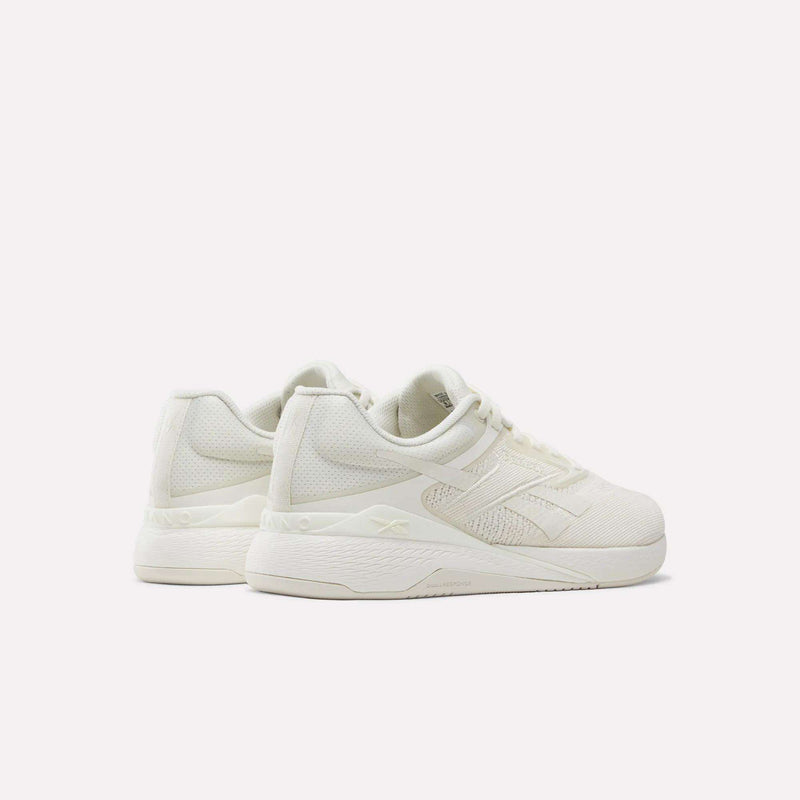 A pair of Reebok Nano X5 Training Shoes in off-white, featuring a textured mesh upper, thick rubber soles, laces, subtle stitched detailing, and a supportive dual-density midsole for enhanced comfort during every workout. Shown on a plain white background.