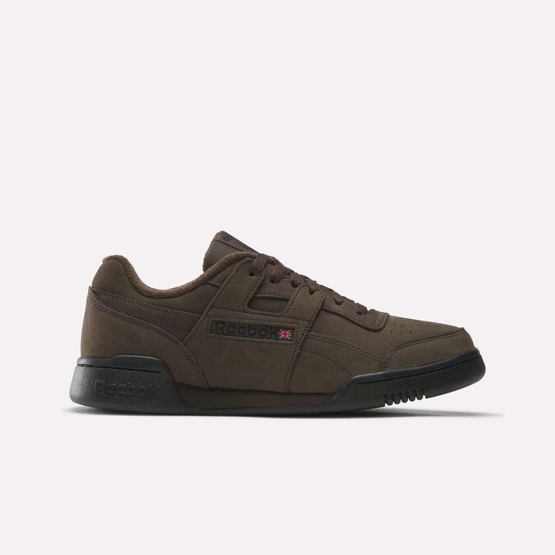 An Espresso/Black Reebok Workout Plus shoe with black soles, laces, and a low-cut design is displayed on a plain white background—these iconic shoes embody the classic style of the Workout Plus collection.