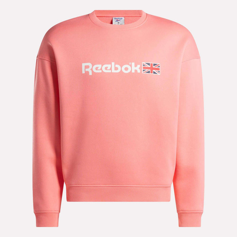 A Reebok Crewneck Sweatshirt in pink, showcasing a relaxed fit with white Reebok branding and a small Union Jack logo on the front, is displayed against a white background.
