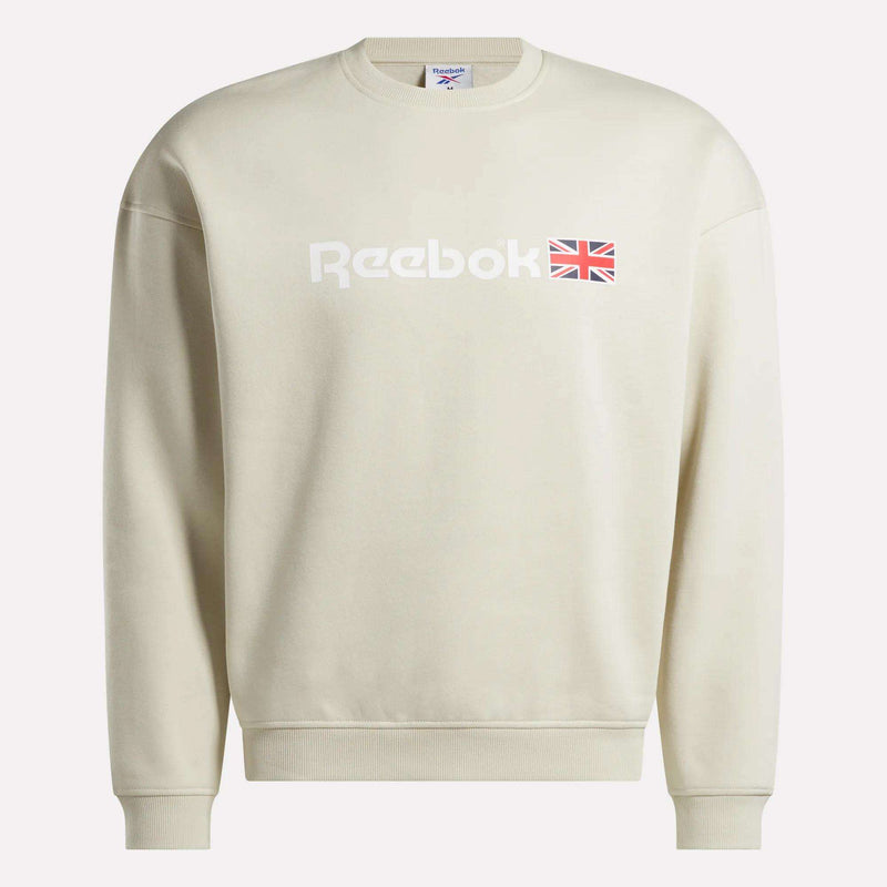 A beige Reebok Crewneck Sweatshirt, designed for everyday comfort in a relaxed fit, features the iconic Reebok logo along with a small Union Jack logo printed on the front.