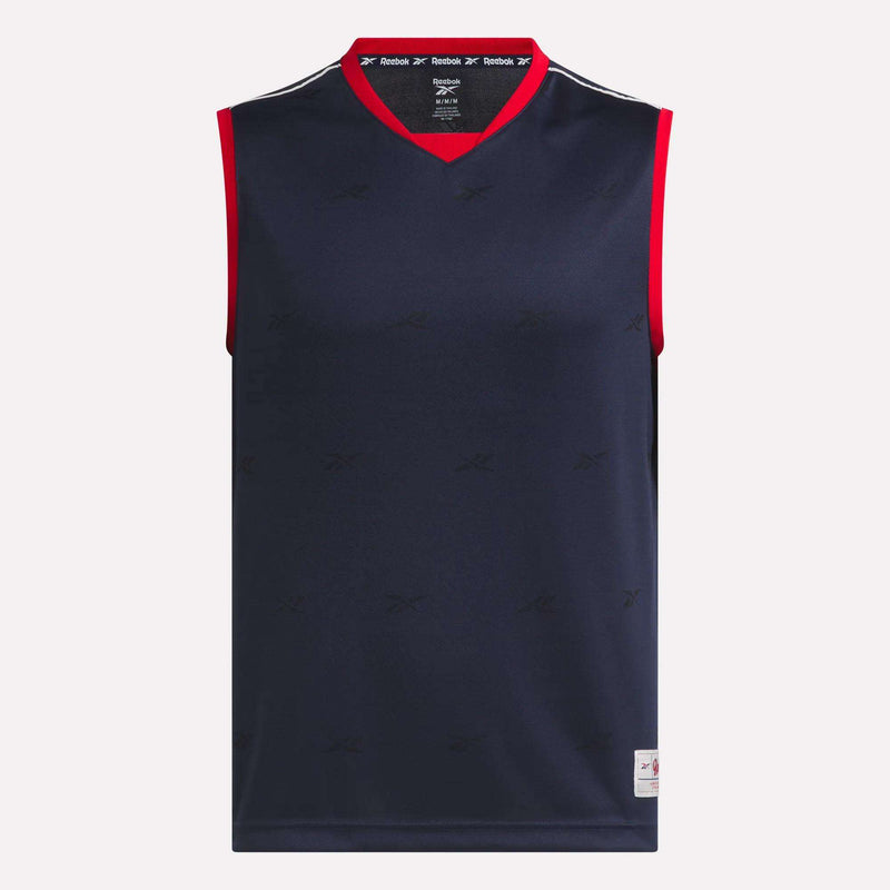 The Reebok Men's United Jersey Tank is a sleeveless navy blue top with red V-neck collar and armhole trim, subtle Reebok logos, and a white tag at the hem—perfect as a soccer sports jersey on or off the field.
