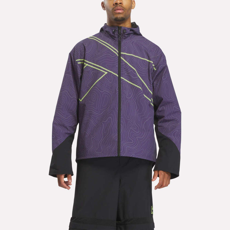 A Reebok x A Herd of Bison Packable Jacket featuring a hooded, zip-up design with a purple topographic line pattern, lime green accents, and solid black cuffs.