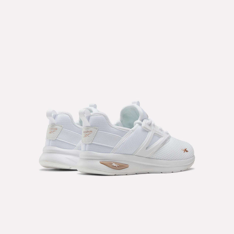 A pair of Reebok Zome Flare Shoes for big kids in white with beige accents is displayed from the back and side on a plain white background—these comfortable shoes are ideal for everyday wear or as stylish gym shoes.