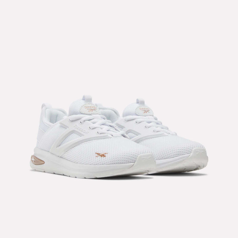 A pair of Reebok Zome Flare Shoes for big kids featuring mesh uppers, subtle gold accents, and white soles, displayed side by side on a plain white background—ideal for those seeking both comfort and style.