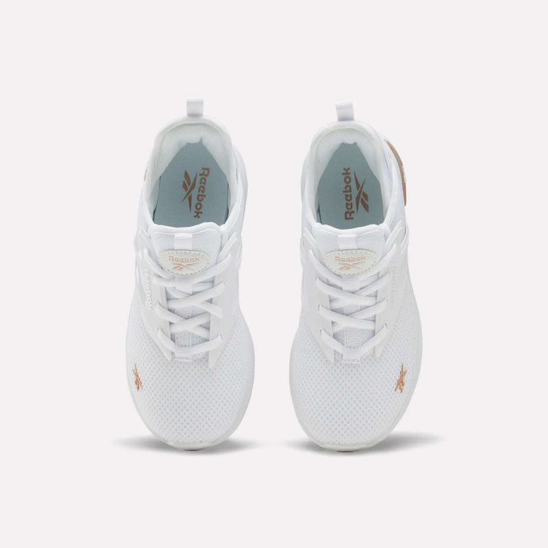 A pair of Reebok Zome Flare Shoes for big kids is shown from above, highlighting the white mesh uppers, matching white laces, and tan Reebok logos on the tongues and sides—making them a comfortable choice for kids.