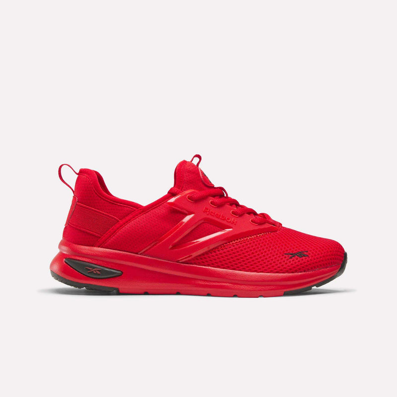 The Reebok Zome Flare Shoes - Big Kids feature a vibrant red color with a breathable mesh upper, lace-up closure, and bold black sole accents. Designed with Reebok logos on the side, tongue, and heel, these stylish sneakers offer a modern, sporty look—making them an ideal choice for kids who want both comfort and style.