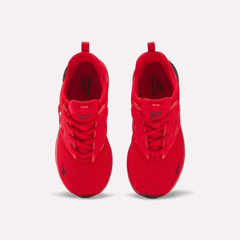 Top view of a pair of vibrant red Reebok Zome Flare Shoes for big kids, featuring bold black logos, black heel accents, and breathable mesh fabric uppers, set against a plain white background. Designed for comfort and support during active play, these sneakers offer standout style and reliable performance for kids on the go.