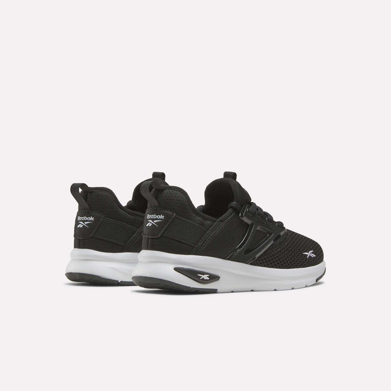A pair of Reebok Zome Flare Shoes for little kids in black with white soles, shown from the back and side against a plain white background—an ideal choice for anyone looking for comfortable sneakers.