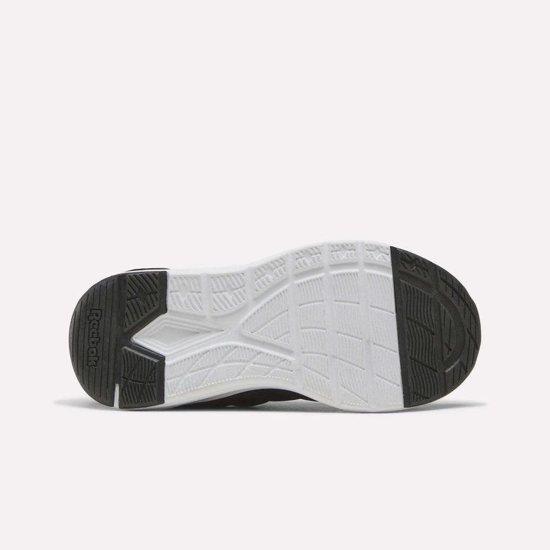 Bottom view of the Reebok Zome Flare Shoes - Little Kids, showing a textured rubber sole with black, white, and gray sections and geometric tread patterns for grip—designed as comfortable sneakers perfect for children.