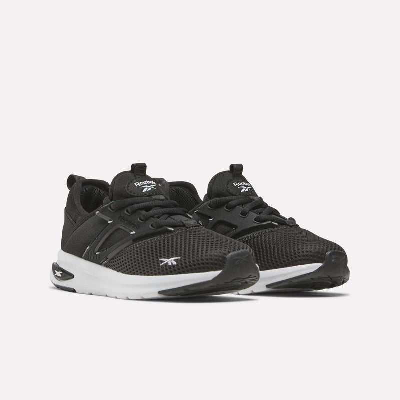 A pair of Zome Flare Shoes - Little Kids by Reebok in black, featuring white soles, mesh uppers, and black laces, displayed on a plain white background—perfect as comfortable sneakers or stylish kids’ shoes for everyday adventures.