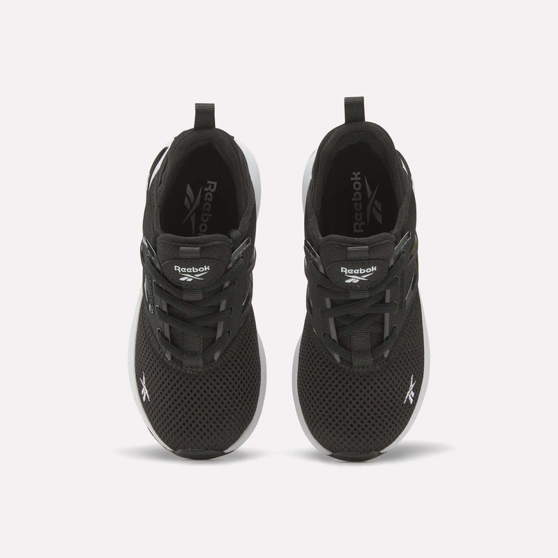 A pair of black Reebok Zome Flare Shoes for little kids, viewed from above, featuring white logos on the tongue and toe, black laces, and white soles—comfortable sneakers perfect for everyday wear.