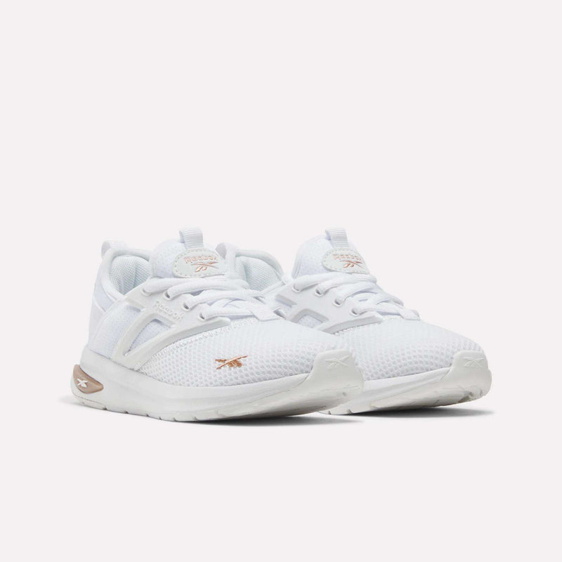 A pair of Reebok Zome Flare Shoes for little kids, featuring white athletic mesh uppers, white soles, and subtle beige Reebok logos on the sides and tongues, placed side by side on a plain white background—these comfortable sneakers are ideal for everyday wear.