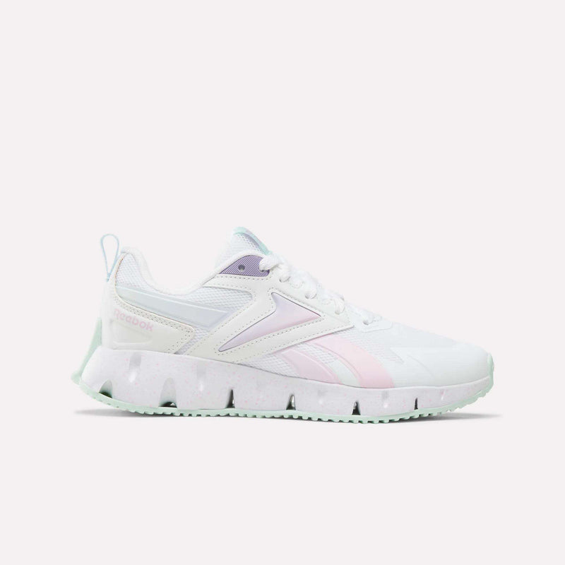Featuring a bright white base with Pirouette and Saltwater Slide accents and the signature Reebok logo, the Pyro Storm Shoes for Big Kids boast a chunky, textured sole and are displayed on a plain white background—these stylish running shoes offer lightweight comfort, making them perfect for kids who want both performance and standout style.