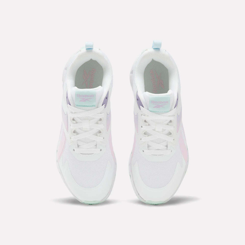 A pair of Reebok Pyro Storm Shoes for big kids in white, featuring pastel pink, purple, and mint green accents, shown from above on a plain white background. Perfect for kids seeking stylish and lightweight running shoes.