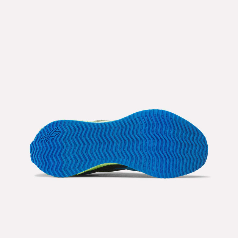 A blue herringbone-patterned, durable rubber outsole featuring a small Reebok logo near the heel is shown photographed from the bottom against a plain white background—just right for kids’ athletic shoes like the Reebok Pyro Storm 1V Shoes - Little Kids.