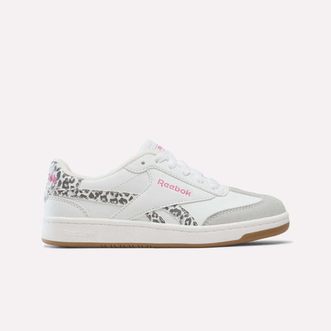 White Reebok Forte Pitch Shoes for Big Kids in White/True Pink, featuring a gray suede toe, pink logo detailing, and leopard print accents on the heel and side, are displayed on a plain white background—these sneakers offer a bold yet classic style perfect for any collection.