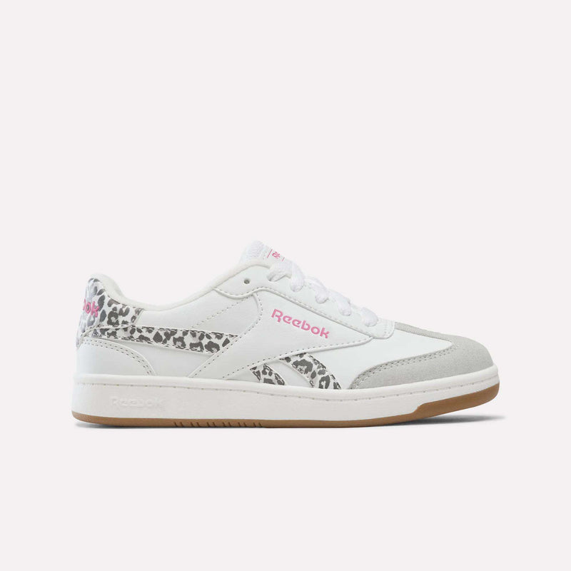 White Reebok Forte Pitch Shoes for Big Kids in White/True Pink, featuring a gray suede toe, pink logo detailing, and leopard print accents on the heel and side, are displayed on a plain white background—these sneakers offer a bold yet classic style perfect for any collection.