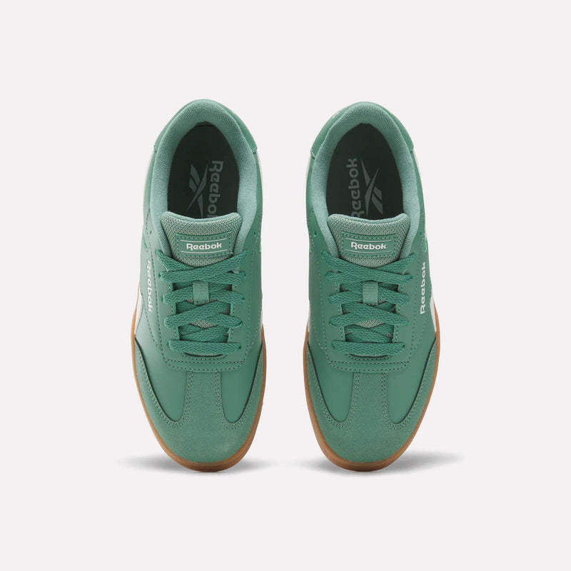 A pair of Reebok Forte Pitch Shoes - Big Kids sneakers in green with gum soles, shown from above on a white background.