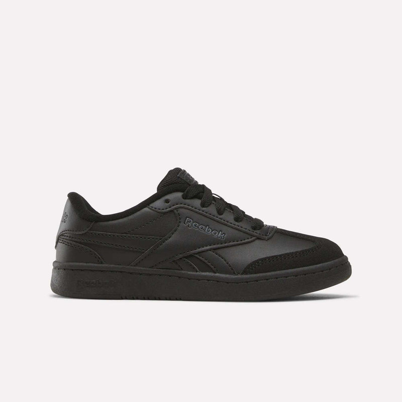 The Reebok Forte Pitch Shoes - Little Kids in black feature a low-profile, lace-up design with subtle side branding; these court-inspired sneakers bring tennis-inspired style and are displayed on a plain white background.