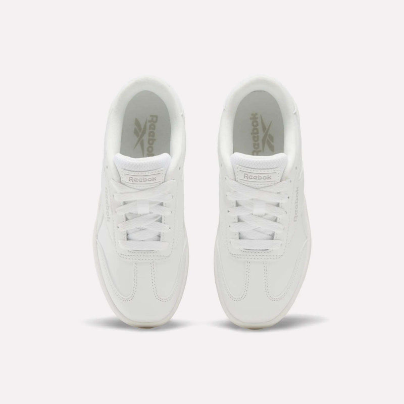 Top view of a pair of white Reebok Forte Pitch Shoes - Little Kids with white laces, placed side by side on a light background, highlighting their classic tennis-inspired style.