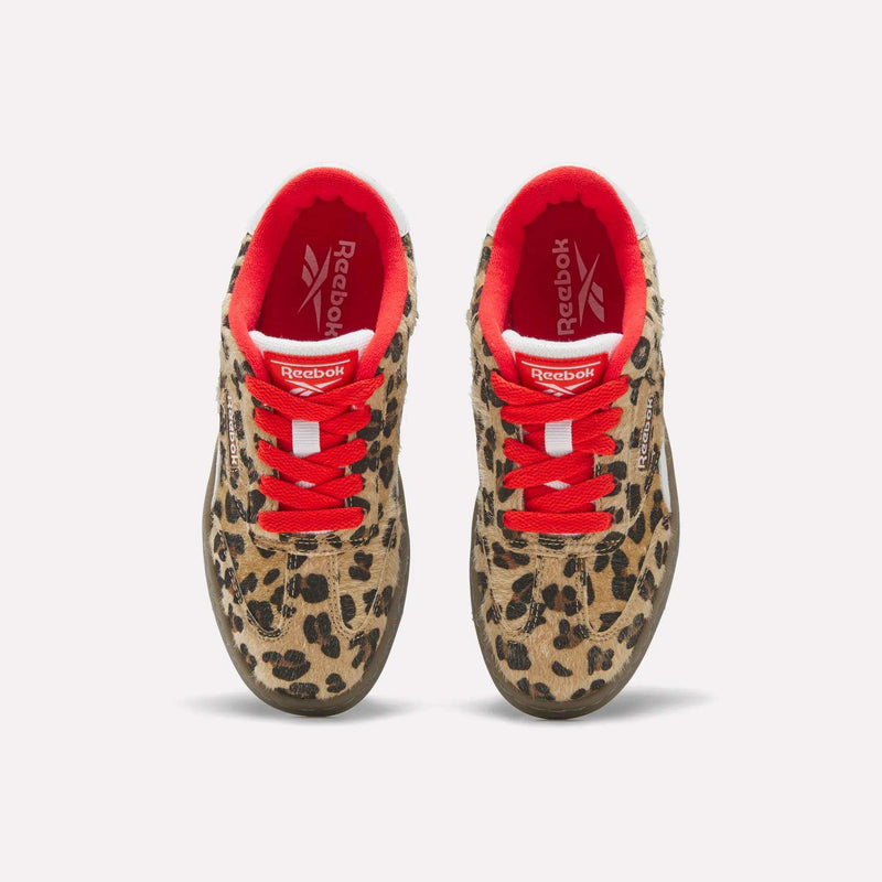 A pair of leopard-print Forte Match T Shoes - Big Kids sneakers by Reebok with bright red laces and interior lining, viewed from above.