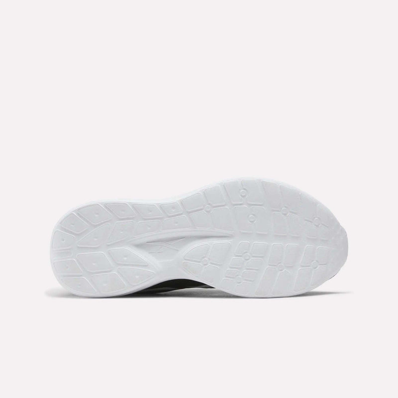 The white, patterned rubber sole of a Reebok Blitzr Run Running Shoes - Big Kids.