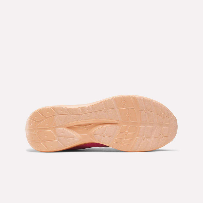 The peach-colored textured rubber outsole of a Reebok Blitzr Run 1V Running Shoes - Little Kids.