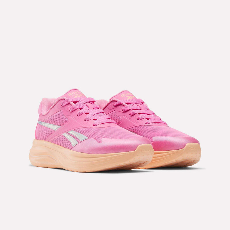 Bright pink Reebok Blitzr Run 1V Running Shoes - Little Kids with silver side stripes and thick peach-colored soles.