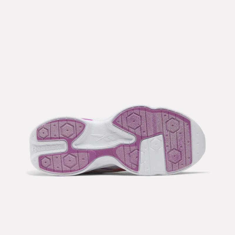 Bottom view of Reebok Charge Shoes - Big Kids with a white sneaker sole featuring textured pink grip pads and a geometric tread pattern.