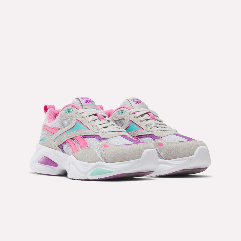 Grey and white chunky Reebok Charge Shoes - Big Kids with bright pink and teal accents and running-inspired cushioning.