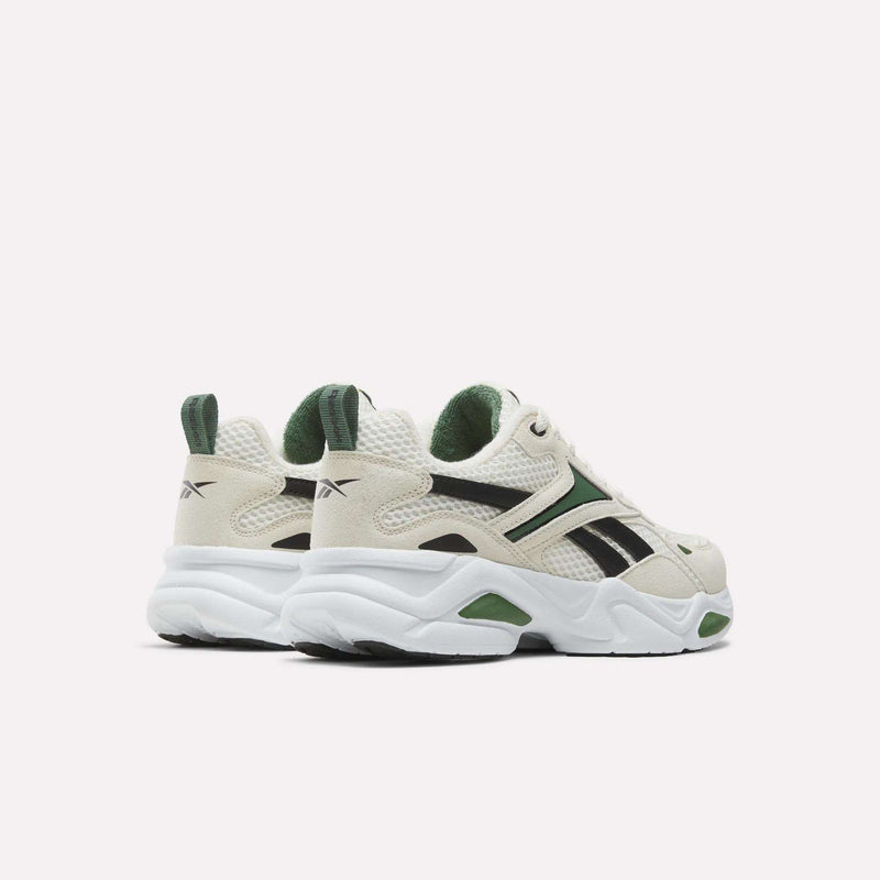 Off-white Charge Shoes - Big Kids by Reebok with green and black accents and thick, cushioning white soles.