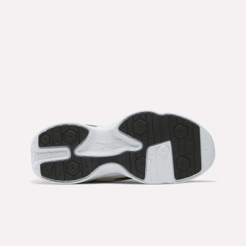 The white and black rubber tread on the sole of these Charge Shoes - Big Kids by Reebok.