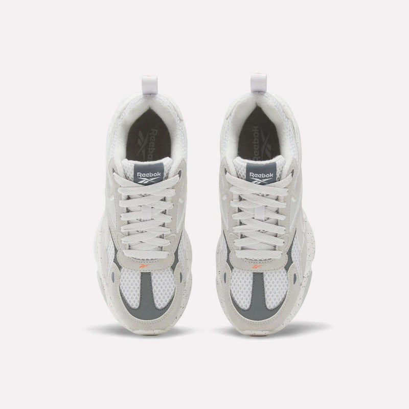 Top-down view of off-white and gray Reebok Charge Shoes - Big Kids running-inspired sneakers.