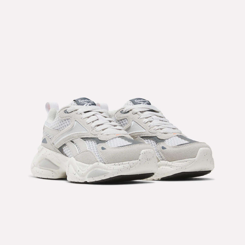Little Kids Charge Shoes by Reebok in white and grey, featuring mesh panels and chunky, speckled outsoles.
