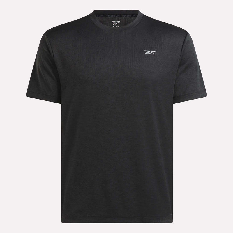 The Reebok Men’s Director Short Sleeve Top is a plain black training t-shirt featuring short sleeves and a subtle Reebok logo on the left chest, shown against a light background. Ideal as a men’s gym top for everyday workouts.