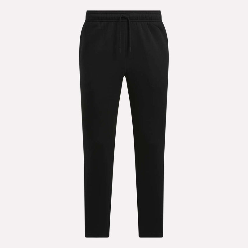 Men’s Patent Pants by Reebok in black, featuring a jogger-style slim fit with an adjustable waistband and drawstring, displayed against a plain white background. These pants have a clean look with no visible logos or patterns.