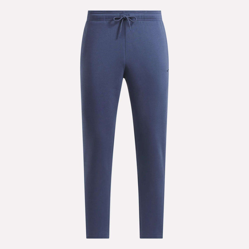 Men’s Patent Pants by Reebok in navy blue, featuring a slim fit, adjustable waistband, and tapered legs—displayed on a plain white background—ideal for those looking for comfortable and stylish Reebok pants.
