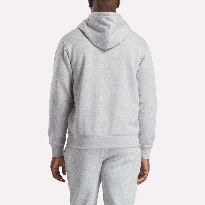 A person is shown from the back against a plain light background, wearing the Reebok Men’s Finisher Hoodie in light gray with matching sweatpants.