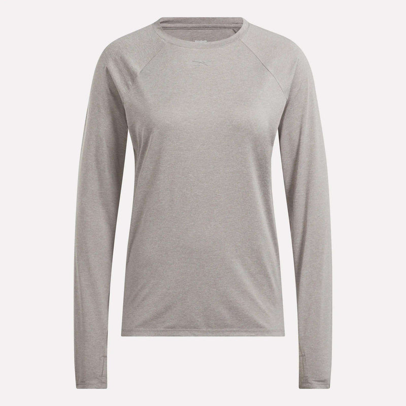 The Women’s Long Sleeve Running Top by Reebok in light gray features a crew neck, subtle stitching, and performance cool touch, shown on a white background.