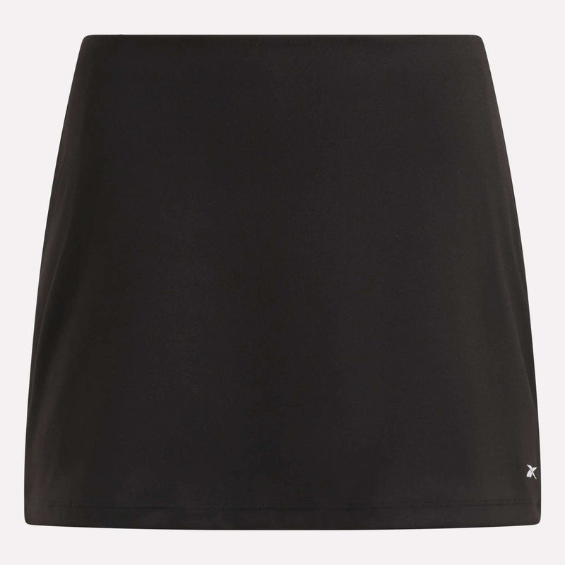 A plain black Reebok Women’s Tennis Skort featuring a small, subtle logo on the lower right hem, displayed against a light background—ideal for bringing court-inspired flair to your everyday outfits.