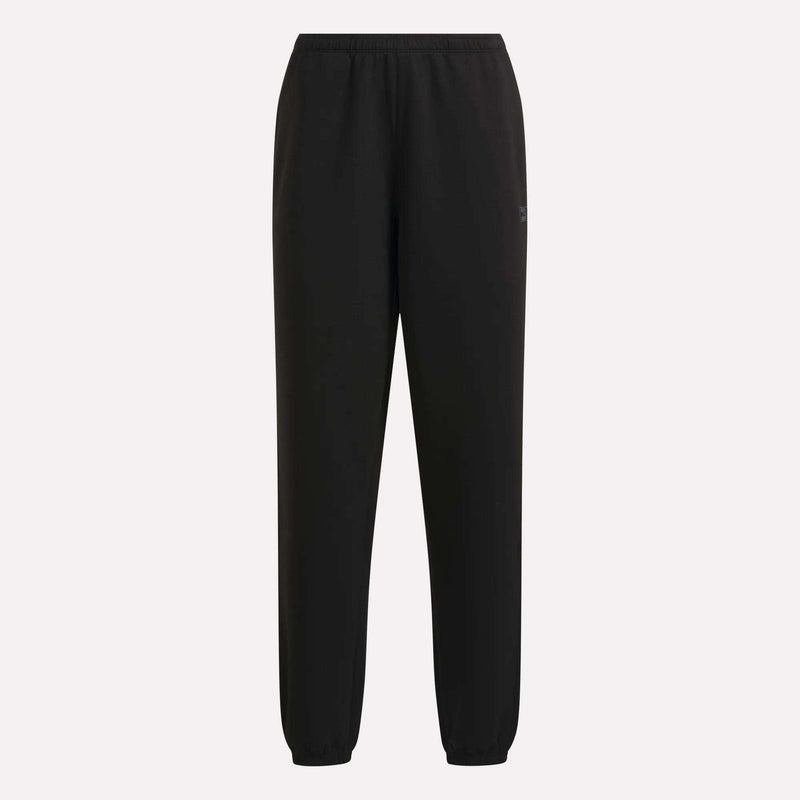 Reebok Women’s Cinched Joggers featuring an elastic waistband and cinched cuffs at the ankles, shown against a plain light background. The simple and classic design ensures comfortable wear with soft fabric, free from any visible logos or decorations.