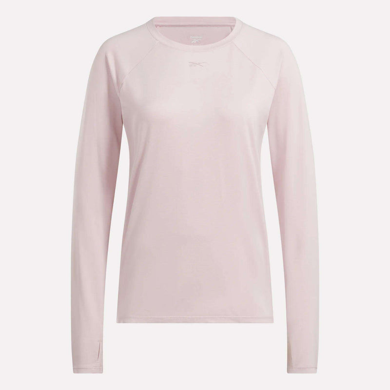 The Reebok Women’s Long Sleeve Running Top features light pink performance cool touch fabric, long sleeves, and a crew neck, shown against a plain white background.